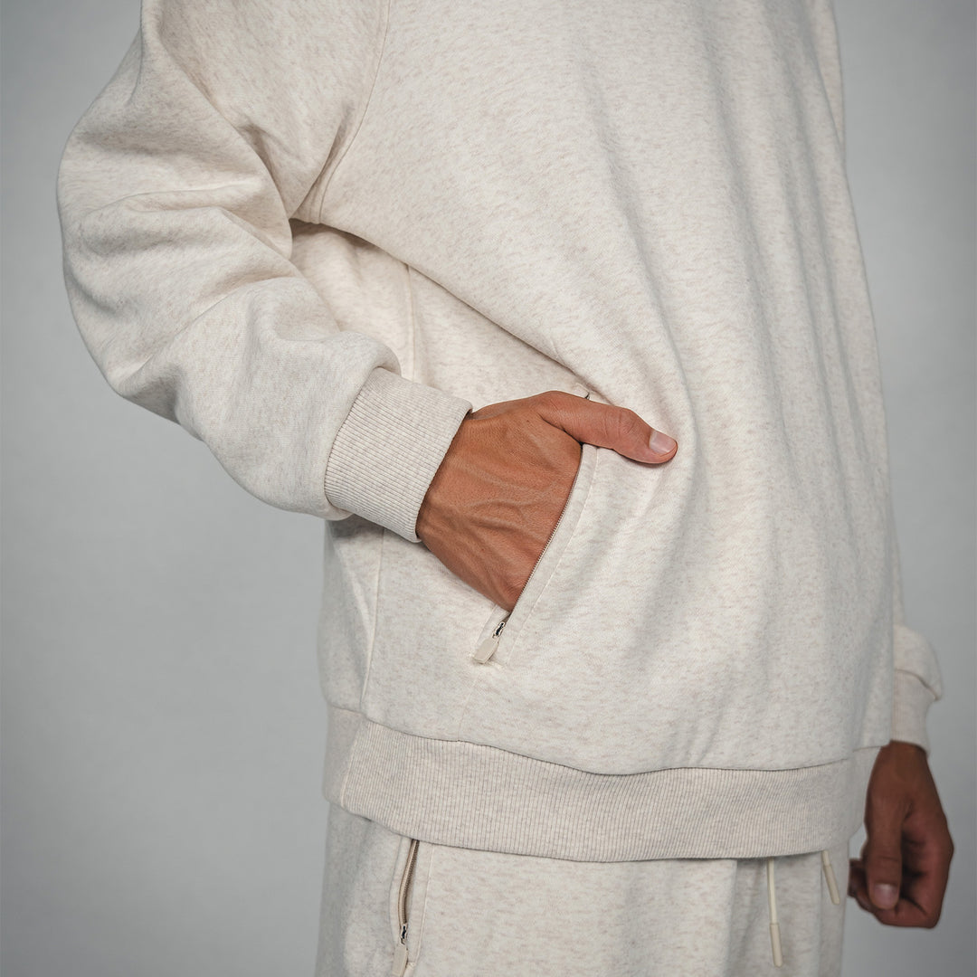 Hoodie Castore Lifestyle beige Tasche Detail